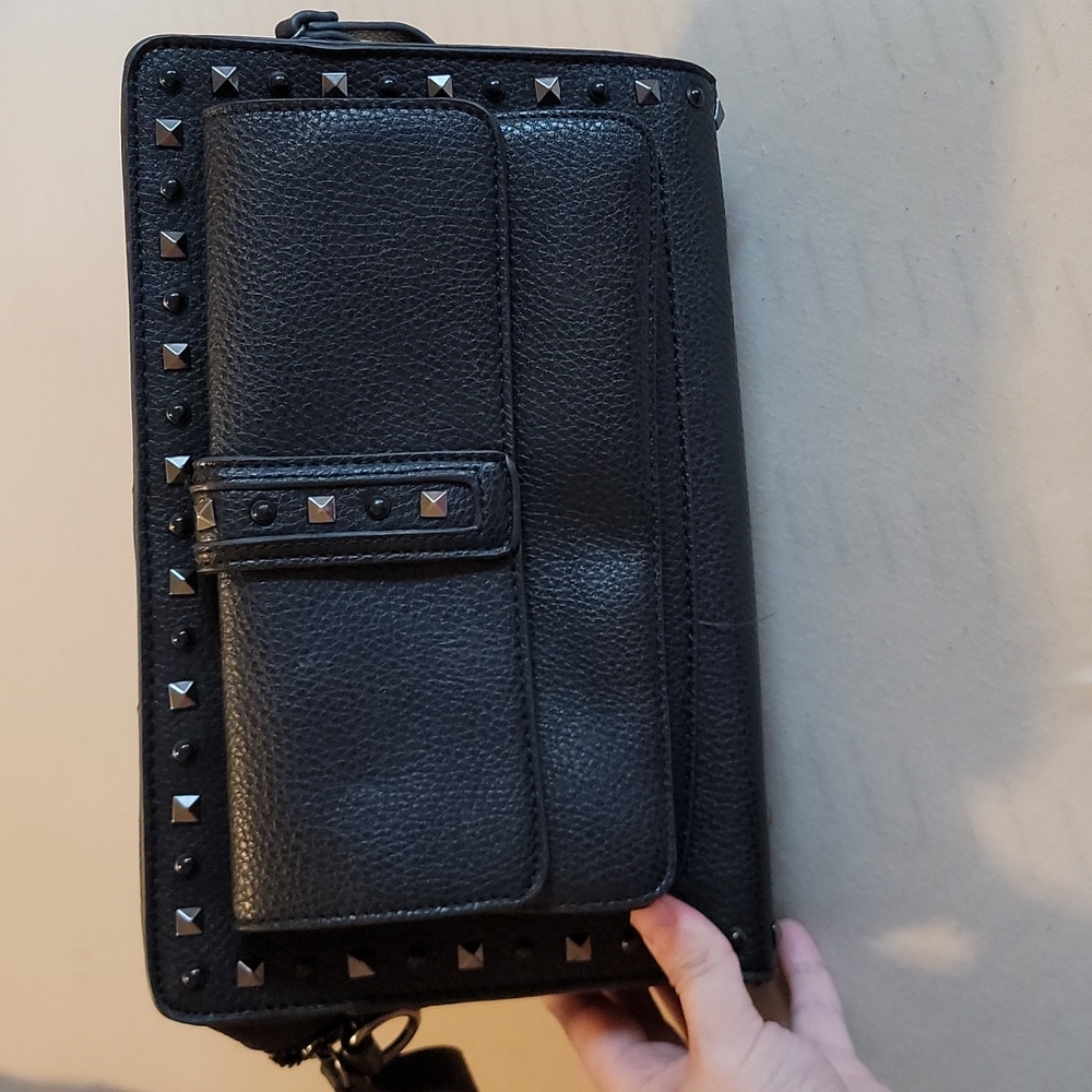 Hand clutch. Black studded design.